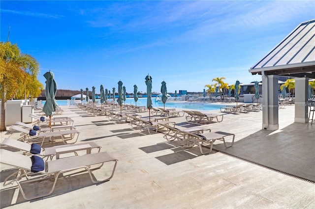 view of pool featuring a water view