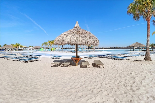 surrounding community featuring a view of the beach, a gazebo, and a water view