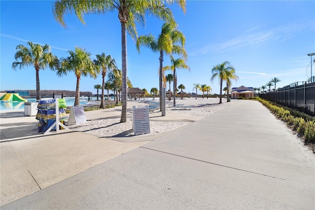 surrounding community featuring a water view