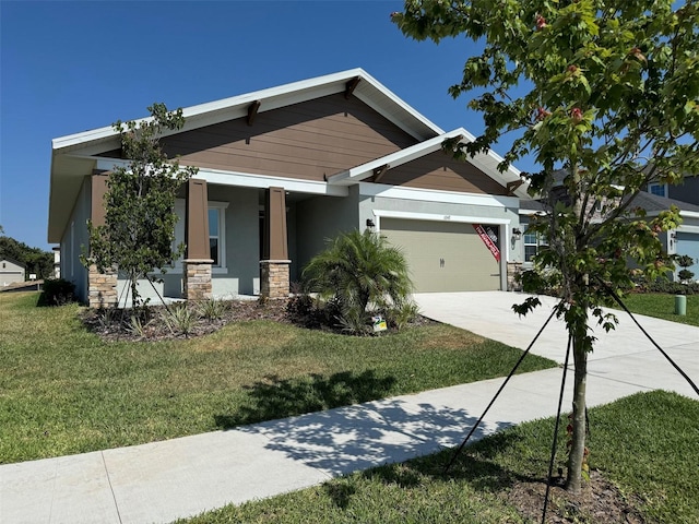 view of front of house with a garage and a front yard