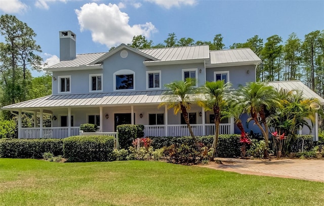 view of front of home featuring a porch and a front lawn