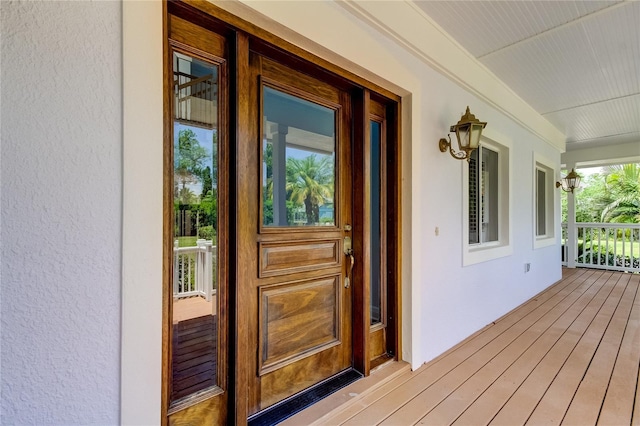 doorway to property with covered porch