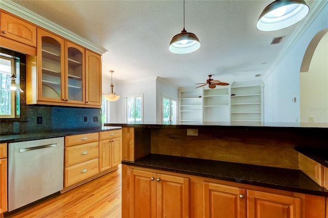 kitchen featuring ceiling fan, decorative light fixtures, stainless steel dishwasher, crown molding, and decorative backsplash