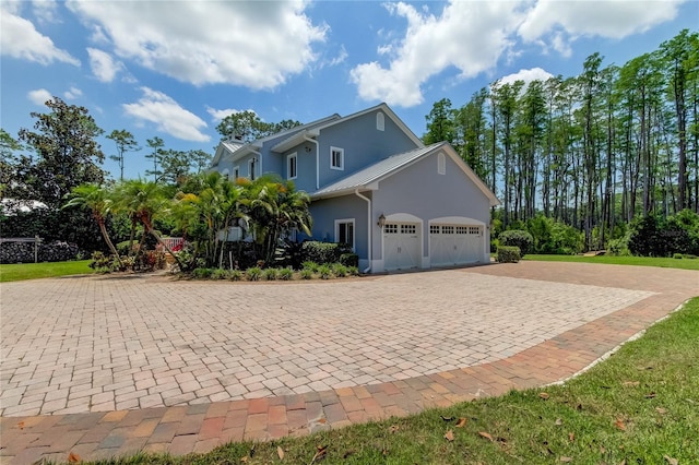 view of side of property with a garage