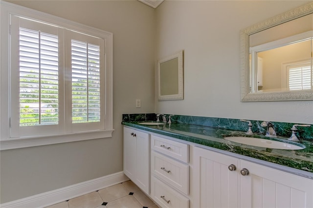 bathroom featuring vanity, tile patterned floors, and plenty of natural light