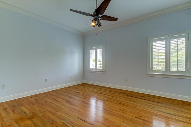 spare room featuring crown molding, light hardwood / wood-style flooring, and ceiling fan