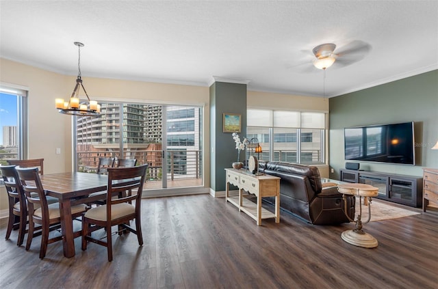 dining area featuring ornamental molding, a healthy amount of sunlight, and dark hardwood / wood-style floors