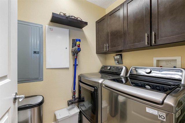 laundry area with washer hookup, washing machine and clothes dryer, and cabinets