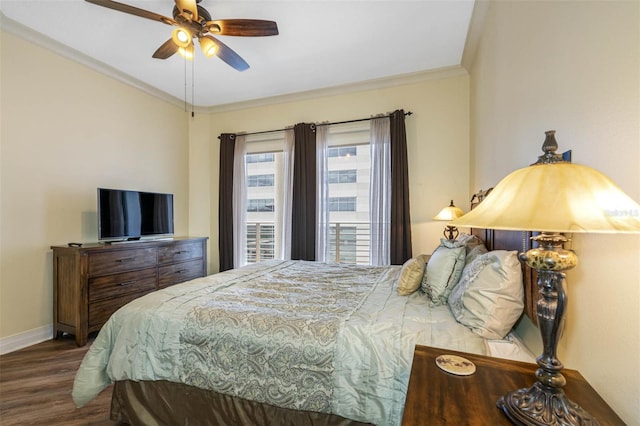 bedroom featuring wood-type flooring, ceiling fan, and crown molding