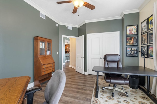 office with crown molding, dark hardwood / wood-style flooring, and ceiling fan