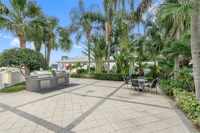 view of patio featuring exterior kitchen and grilling area