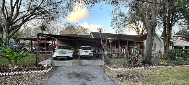 view of front of property with a carport and a porch