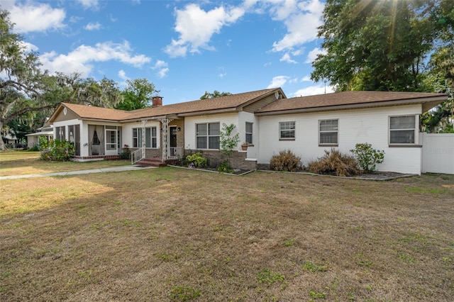 ranch-style home with a front yard