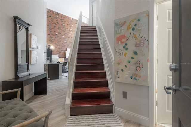 stairway featuring light hardwood / wood-style flooring