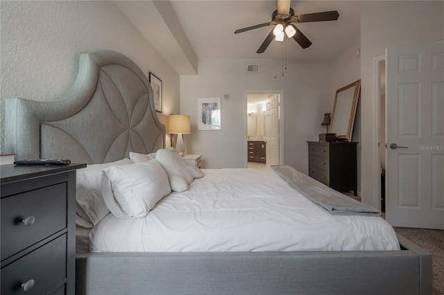 carpeted bedroom with ceiling fan and connected bathroom