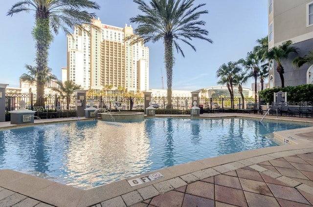 view of swimming pool featuring pool water feature