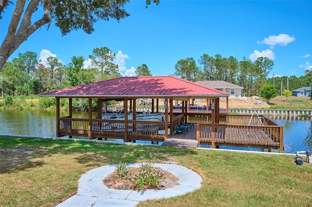 view of dock featuring a lawn and a water view