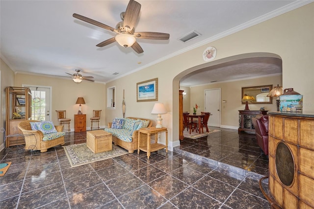 living room with ceiling fan and ornamental molding