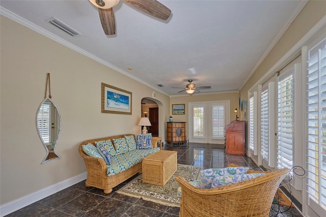 living area with plenty of natural light, ceiling fan, and ornamental molding