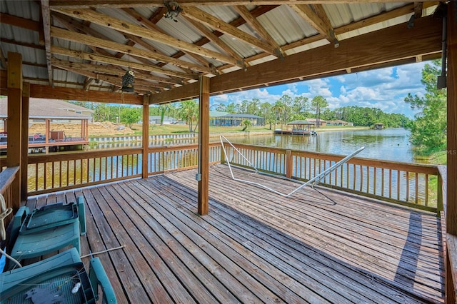 wooden deck featuring a water view