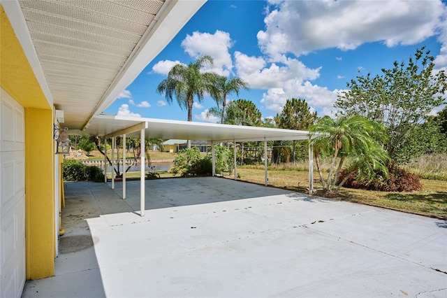 view of vehicle parking with a carport