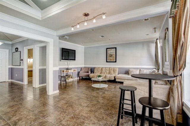 living room with track lighting, ornamental molding, and tile floors