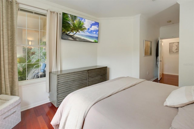 bedroom with ornamental molding and dark wood-type flooring