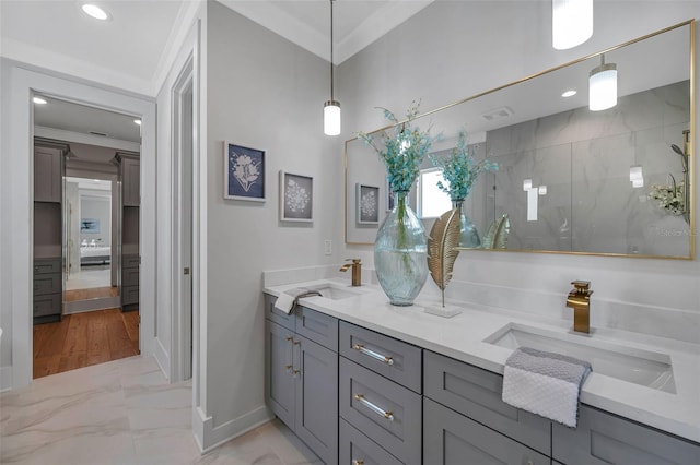 bathroom with an enclosed shower, vanity, and ornamental molding