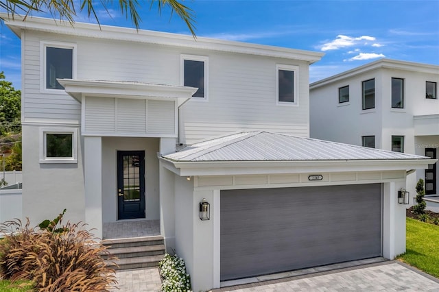 view of front of property featuring a garage