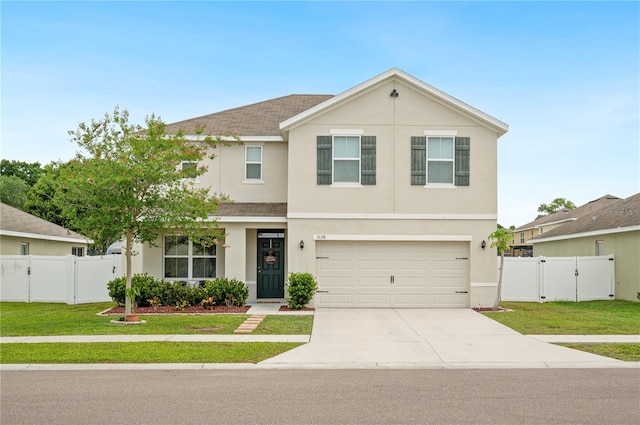 view of front of home featuring a garage and a front yard