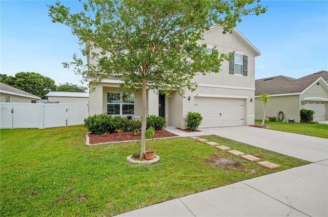 view of front of home with a garage and a front lawn