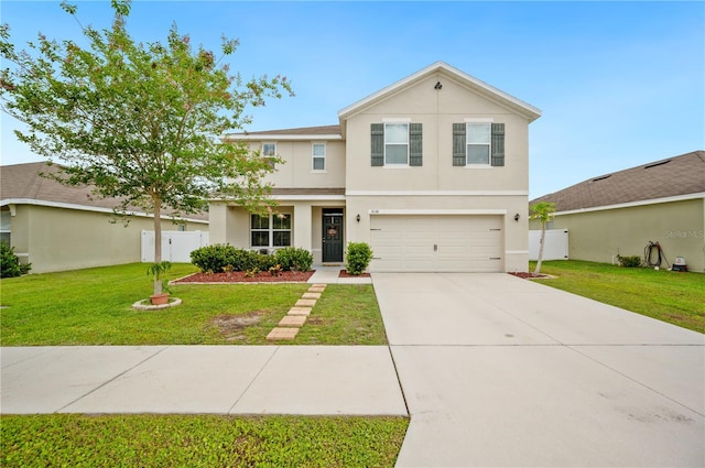 view of front of house featuring a garage and a front yard