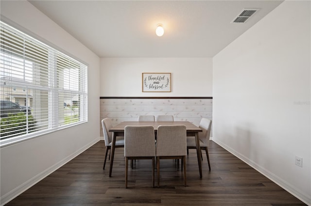 dining room with dark hardwood / wood-style floors