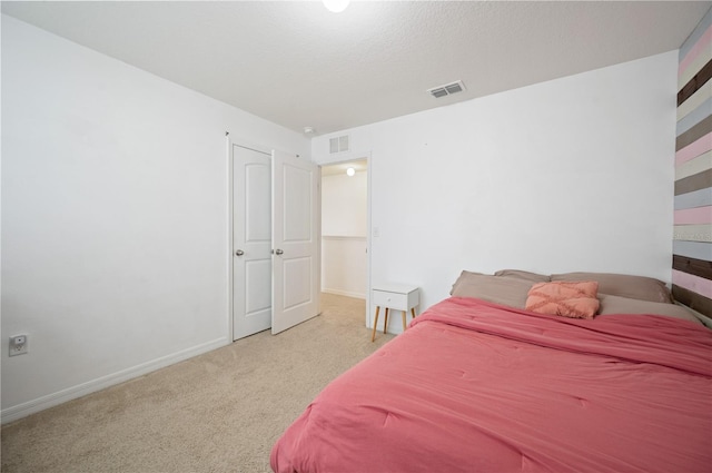 bedroom featuring light carpet