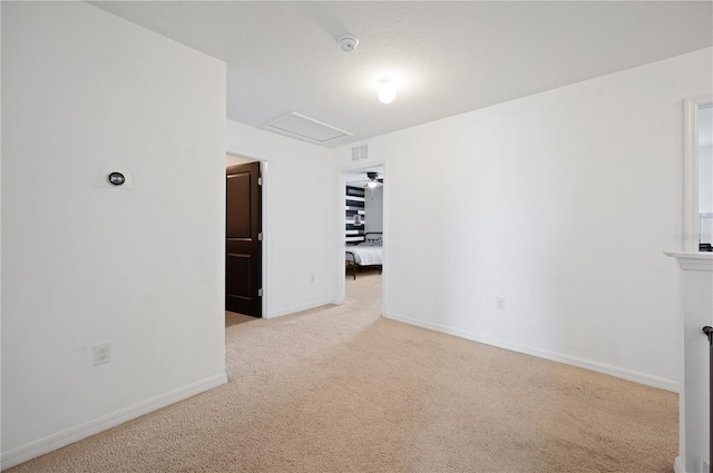 unfurnished room with light colored carpet