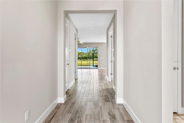 hall with light hardwood / wood-style floors