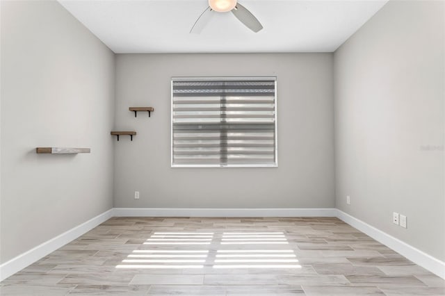 empty room featuring ceiling fan and light wood-type flooring