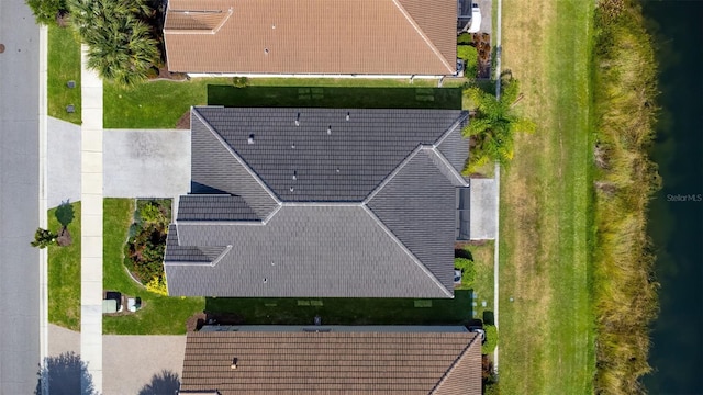 birds eye view of property featuring a water view