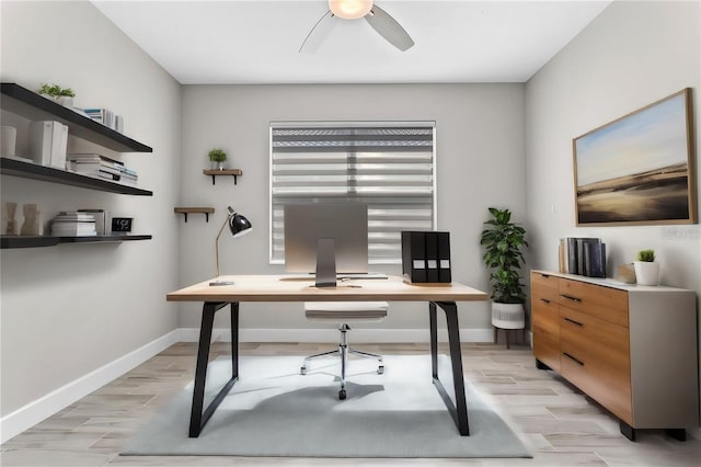 office space featuring light hardwood / wood-style floors and ceiling fan