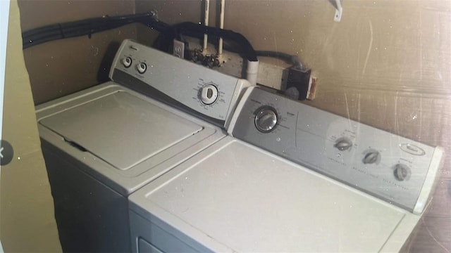 washroom with washer hookup and washing machine and clothes dryer