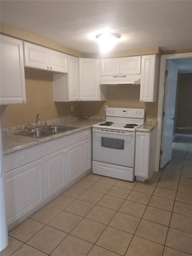 kitchen featuring electric range, sink, white cabinetry, and light tile floors