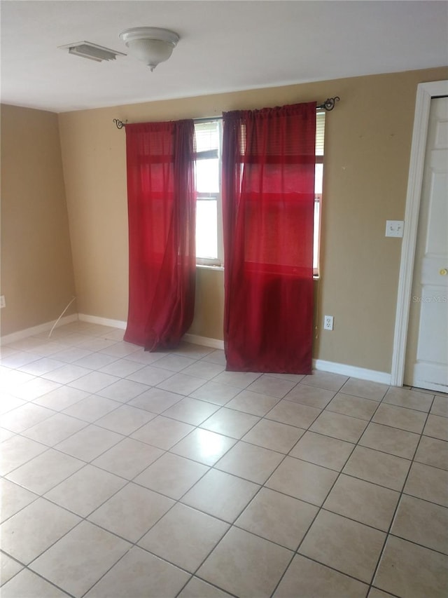 empty room with light tile floors