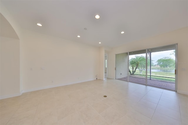 empty room with light tile patterned floors