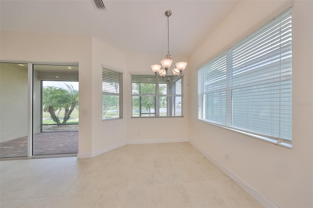 unfurnished dining area with a notable chandelier