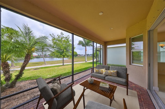 sunroom / solarium with a water view