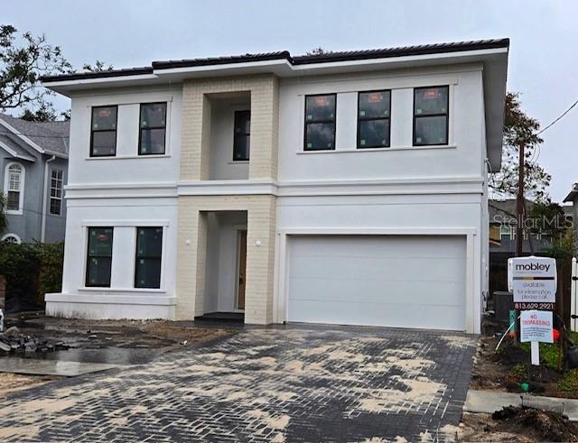 view of front of property featuring a garage