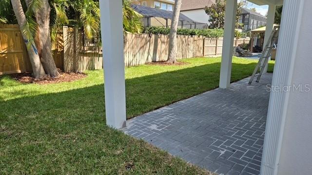 view of yard with a patio area and a fenced backyard