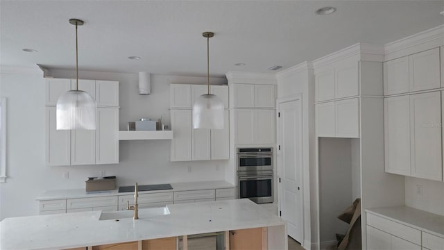 kitchen featuring double oven, black electric stovetop, a sink, and white cabinets