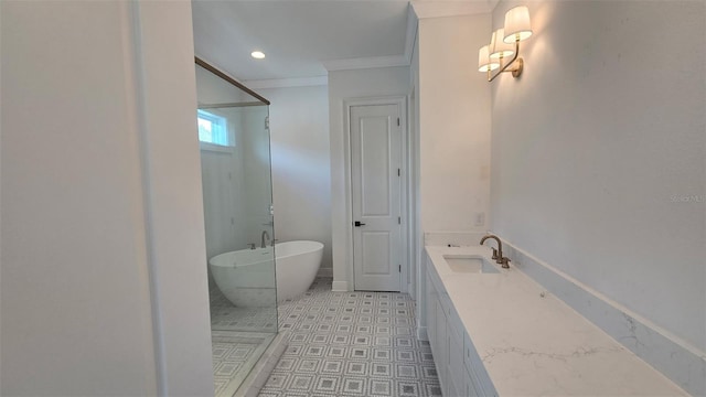 full bath featuring recessed lighting, a freestanding bath, ornamental molding, a stall shower, and a sink