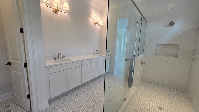 bathroom featuring ornamental molding, a sink, and walk in shower